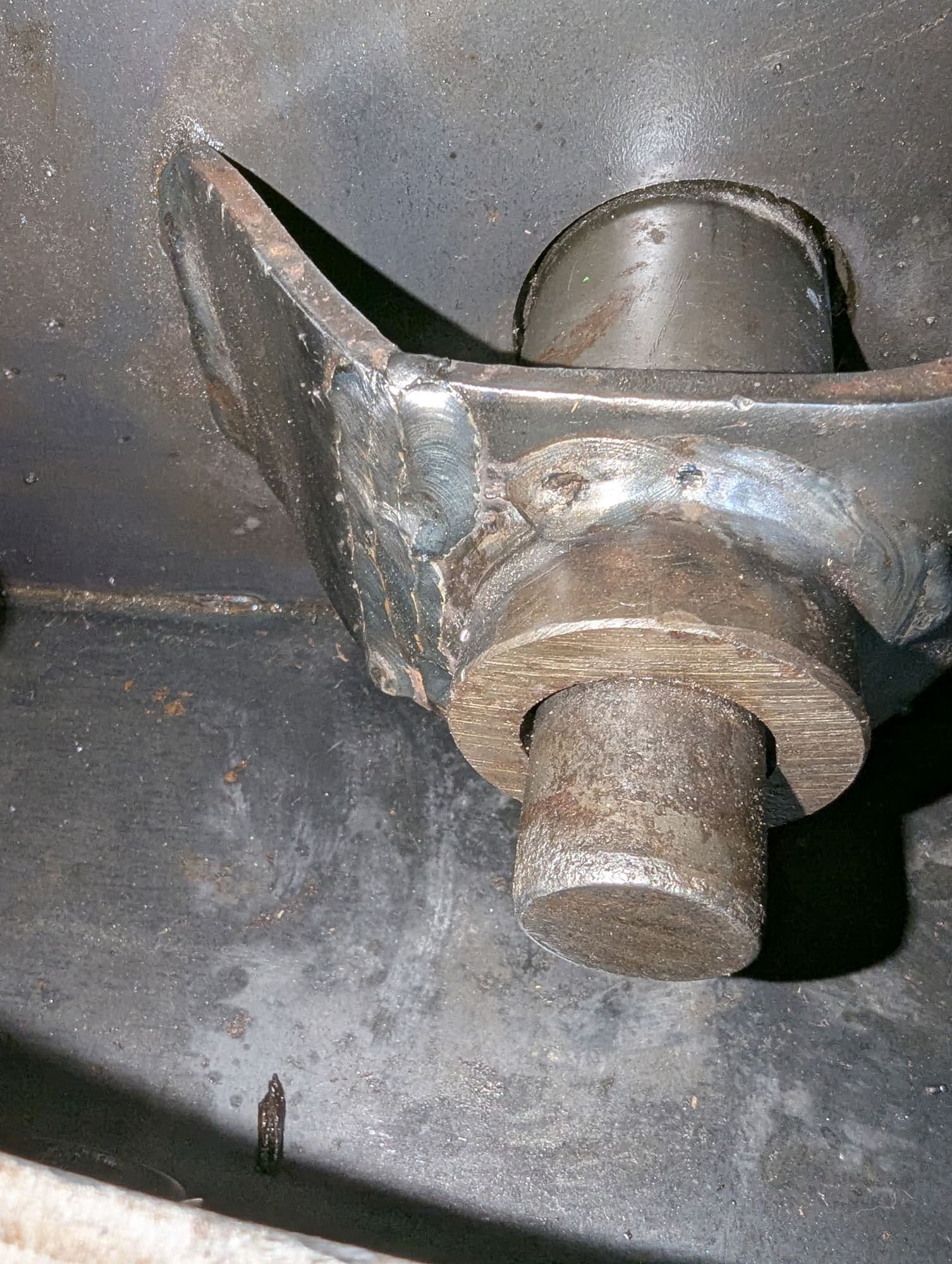 The same bracket rejoined with fresh weld beads