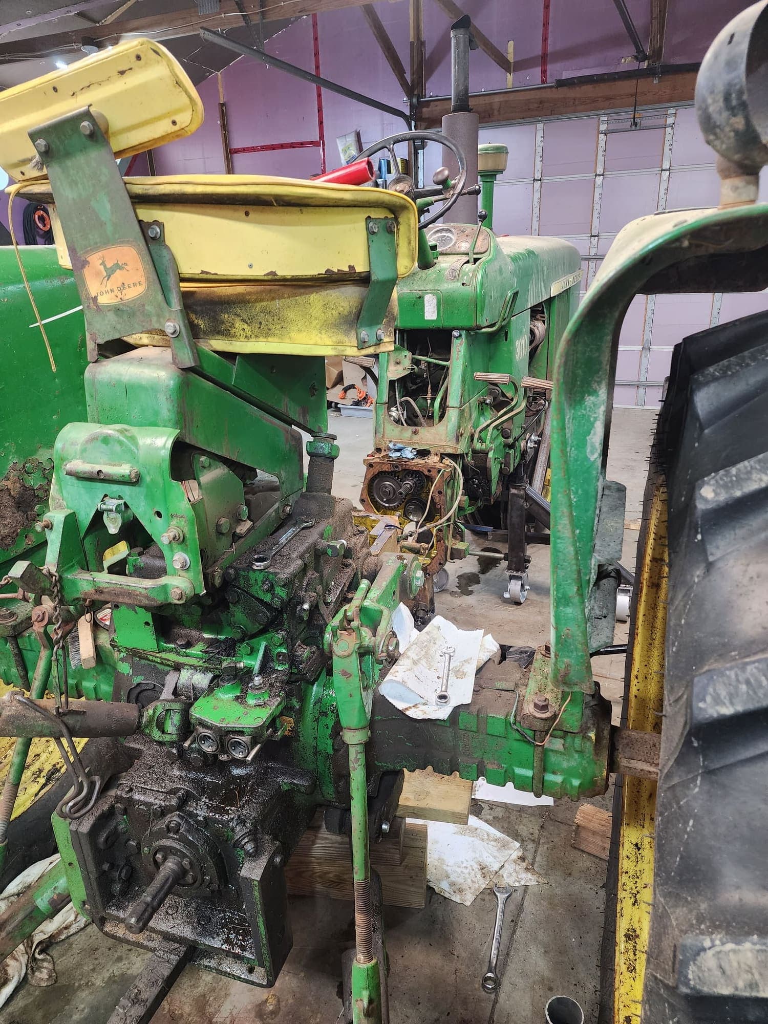 John Deere 3010 opened up in the shop during teardown, rear end split from the tractor