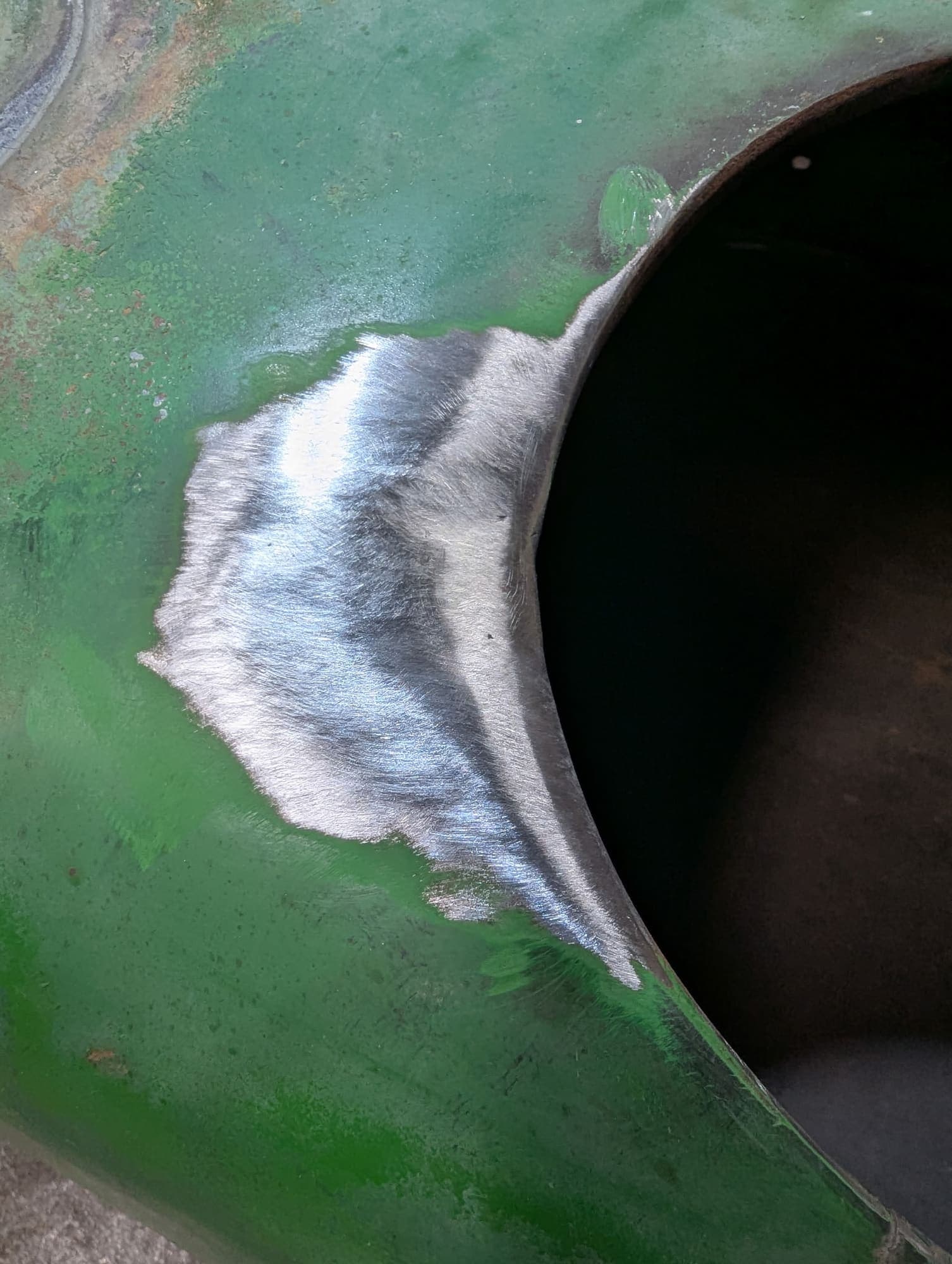 The same panel after welding, ground smooth with the crack gone
